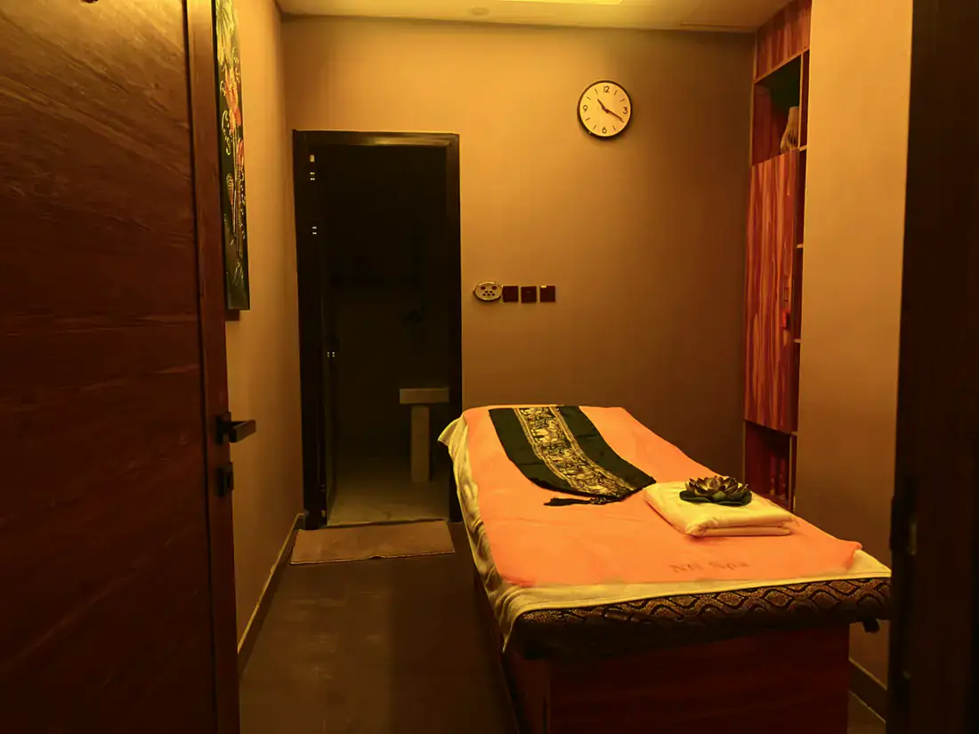 Private treatment room at Next Balance Spa with fresh linen and an en-suite shower